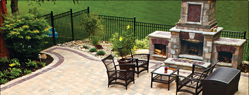 outdoor stone fireplace and interlocking patio